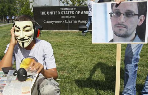 Activists from the Internet Party of Ukraine perform during a rally supporting Edward Snowden, a former contractor at the National Security Activists from the Internet Party of Ukraine perform during a rally supporting Edward Snowden, a former contractor at the National Security