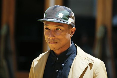 Recording artist Pharrell Williams poses at the American premiere of the animated film "Despicable Me 2" at Universal CityWalk and Gibson Am Recording artist Pharrell Williams poses at the American premiere of the animated film "Despicable Me 2" at Universal CityWalk and Gibson Am