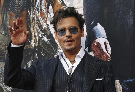 Cast member Johnny Depp waves at the world premiere of "The Lone Ranger" at Disney California Adventure Park in Anaheim, California June 22, Cast member Johnny Depp waves at the world premiere of "The Lone Ranger" at Disney California Adventure Park in Anaheim, California June 22,