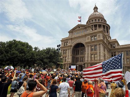Protesters rally before the start of a special session of the Legislature in Austin, Texas July 1, 2013. REUTERS/Mike Stone Protesters rally before the start of a special session of the Legislature in Austin, Texas July 1, 2013. REUTERS/Mike Stone