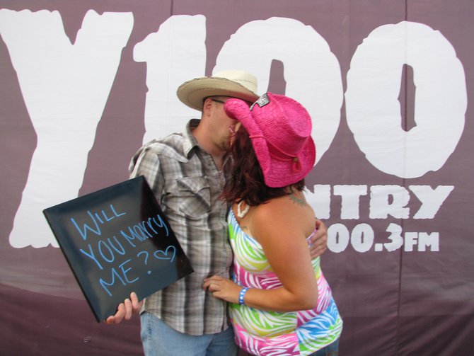 He asked her to marry him in our "Show Us Your Smiles" photo booth with Northstar Dental. She said yes, then this happened...