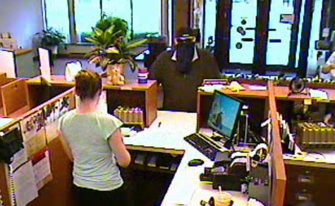 Security camera footage provided by the Calhoun County Sheriff's Office shows the suspect in the June 28, 2013 robbery of the Tekonsha branch of Southern Michigan Bank & Trust. Security camera footage provided by the Calhoun County Sheriff's Office shows the suspect in the June 28, 2013 robbery of the Tekonsha branch of Southern Michigan Bank & Trust.