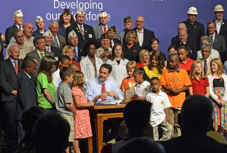 Governor Scott Walker at the 2013 state budget signing ceremony. (Photo: Wisconsin Radio Network) Governor Scott Walker at the 2013 state budget signing ceremony. (Photo: Wisconsin Radio Network)