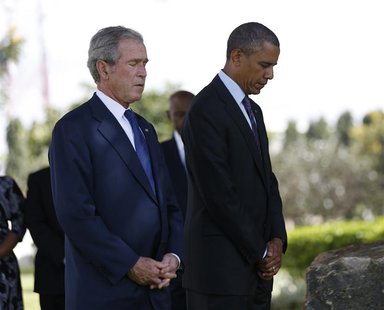 U.S. President Barack Obama and former President George W. Bush (R) attend a memorial for the victims of the 1998 U.S. Embassy bombing in Da U.S. President Barack Obama and former President George W. Bush (R) attend a memorial for the victims of the 1998 U.S. Embassy bombing in Da