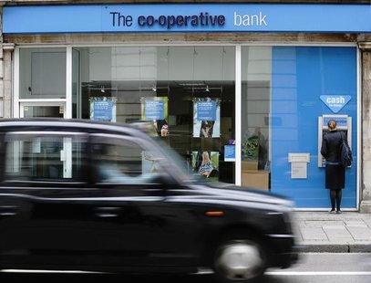 A taxi passes a branch of the Co-Operative Bank in central London June 17, 2013. REUTERS/Luke MacGregor A taxi passes a branch of the Co-Operative Bank in central London June 17, 2013. REUTERS/Luke MacGregor
