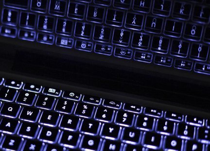 Backlit keyboard is reflected in screen of Apple Macbook Pro notebook computer in Warsaw February 6, 2012. REUTERS/Kacper Pempel Backlit keyboard is reflected in screen of Apple Macbook Pro notebook computer in Warsaw February 6, 2012. REUTERS/Kacper Pempel