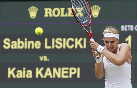 Sabine Lisicki of Germany hits a return to Kaia Kanepi of Estonia during their women's quarter-final tennis match at the Wimbledon Tennis Ch Sabine Lisicki of Germany hits a return to Kaia Kanepi of Estonia during their women's quarter-final tennis match at the Wimbledon Tennis Ch