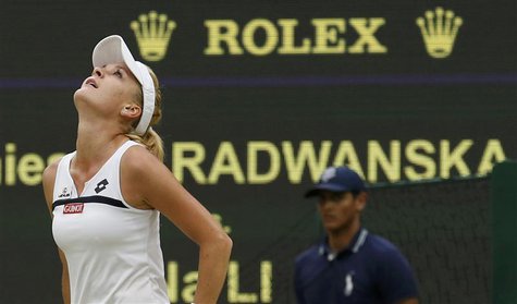 Agnieszka Radwanska of Poland celebrates after defeating Li Na of China in their women's quarter-final tennis match at the Wimbledon Tennis Agnieszka Radwanska of Poland celebrates after defeating Li Na of China in their women's quarter-final tennis match at the Wimbledon Tennis