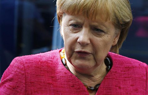 German Chancellor Angela Merkel frowns during a visit to technology company Trumpf in Ditzingen, near Stuttgart July 2, 2013. REUTERS/Michae German Chancellor Angela Merkel frowns during a visit to technology company Trumpf in Ditzingen, near Stuttgart July 2, 2013. REUTERS/Michae