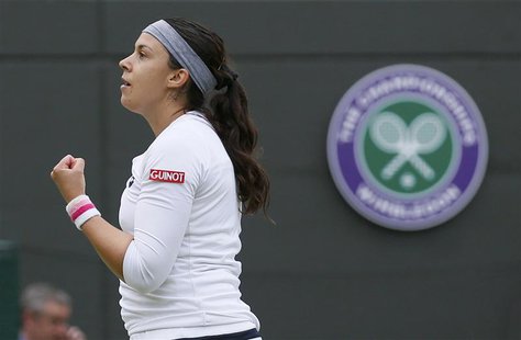 Marion Bartoli of France reacts after defeating Sloane Stephens of the U.S. in their women's quarter-final tennis match at the Wimbledon Ten Marion Bartoli of France reacts after defeating Sloane Stephens of the U.S. in their women's quarter-final tennis match at the Wimbledon Ten
