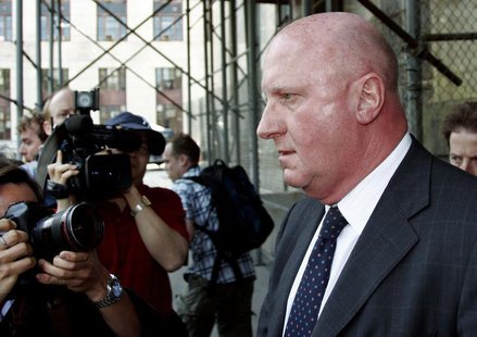 Former chief executive of Tyco International Dennis Kozlowski (R) leaves New York State Supreme Court in New York City, June 17, 2005. REUTE Former chief executive of Tyco International Dennis Kozlowski (R) leaves New York State Supreme Court in New York City, June 17, 2005. REUTE