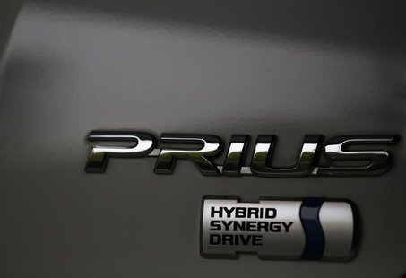 The logo of Toyota Motor Corp's Prius hybrid car is seen on its body at the company's showroom in Tokyo April 17, 2013. REUTERS/Issei Kato The logo of Toyota Motor Corp's Prius hybrid car is seen on its body at the company's showroom in Tokyo April 17, 2013. REUTERS/Issei Kato