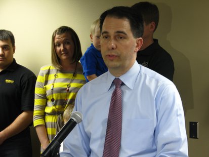 Walker addresses reporters at NTC. Walker addresses reporters at NTC.