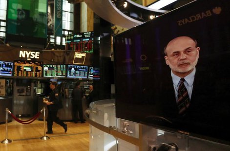 A press conference by Federal Reserve Chairman Ben Bernanke is seen on a television on the floor of the New York Stock Exchange, March 20, 2 A press conference by Federal Reserve Chairman Ben Bernanke is seen on a television on the floor of the New York Stock Exchange, March 20, 2