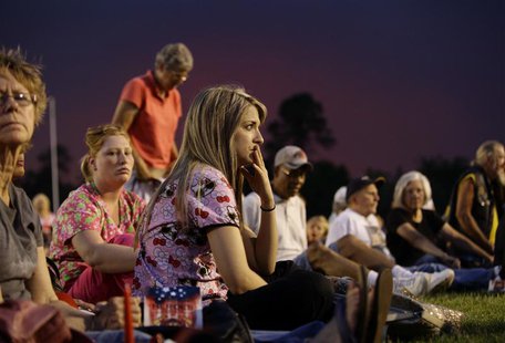 People attend a memorial service at Prescott High School for 19 firefighters who perished battling a fast-moving wildfire in Prescott, Arizo People attend a memorial service at Prescott High School for 19 firefighters who perished battling a fast-moving wildfire in Prescott, Arizo