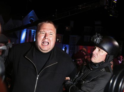 An actor in police costume mock-arrests Megaupload founder Kim Dotcom (L) as he launches his new file sharing site "Mega" in Auckland Januar An actor in police costume mock-arrests Megaupload founder Kim Dotcom (L) as he launches his new file sharing site "Mega" in Auckland Januar