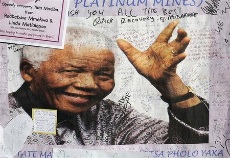 A poster of former South African President Nelson Mandela is filled with get well messages outside the Medi-Clinic Heart Hospital, where he A poster of former South African President Nelson Mandela is filled with get well messages outside the Medi-Clinic Heart Hospital, where he
