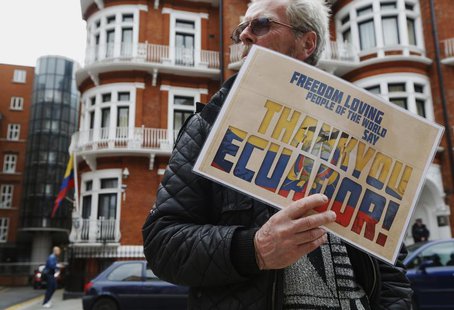 A supporter of Edward Snowden holds a sign that reads "Thank You Ecuador", outside the Embassy of Ecuador in London June 24, 2013. REUTERS/L A supporter of Edward Snowden holds a sign that reads "Thank You Ecuador", outside the Embassy of Ecuador in London June 24, 2013. REUTERS/L