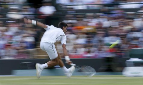 Novak Djokovic of Serbia hits a return to Tomas Berdych of the Czech Republic during their men's quarter-final tennis match at the Wimbledon Novak Djokovic of Serbia hits a return to Tomas Berdych of the Czech Republic during their men's quarter-final tennis match at the Wimbledon
