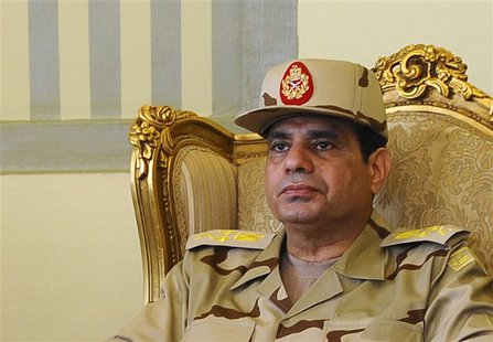 Egypt's Defense Minister Abdel Fattah al-Sisi is seen during a news conference in Cairo on the release of seven members of the Egyptian secu Egypt's Defense Minister Abdel Fattah al-Sisi is seen during a news conference in Cairo on the release of seven members of the Egyptian secu