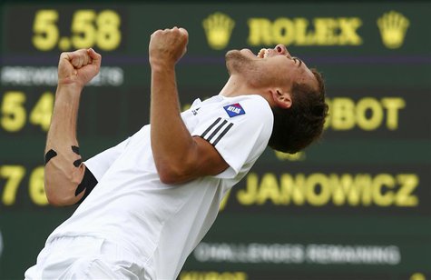 Jerzy Janowicz of Poland celebrates after defeating Lukasz Kubot of Poland in their men's quarter-final tennis match at the Wimbledon Tennis Jerzy Janowicz of Poland celebrates after defeating Lukasz Kubot of Poland in their men's quarter-final tennis match at the Wimbledon Tennis
