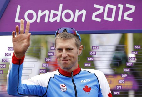 Canada's Ryder Hesjedal gestures at the start of the men's cycling road race at the London 2012 Olympic Games July 28, 2012. REUTERS/Phil No Canada's Ryder Hesjedal gestures at the start of the men's cycling road race at the London 2012 Olympic Games July 28, 2012. REUTERS/Phil No