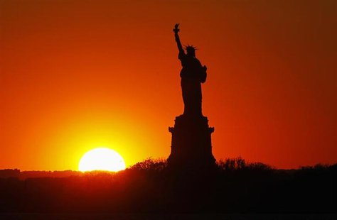 The sun sets behind the Statue of Liberty in New York, May 26, 2013. The statue and Liberty Island will reopen to the public on July 4 after The sun sets behind the Statue of Liberty in New York, May 26, 2013. The statue and Liberty Island will reopen to the public on July 4 after
