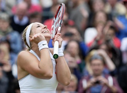 Sabine Lisicki of Germany celebrates after defeating Kaia Kanepi of Estonia in their women's quarter-final tennis match at the Wimbledon Ten Sabine Lisicki of Germany celebrates after defeating Kaia Kanepi of Estonia in their women's quarter-final tennis match at the Wimbledon Ten