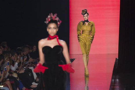 Models present creations by French designer Jean Paul Gaultier as part of his Haute Couture Fall Winter 2013/2014 fashion show in Paris July Models present creations by French designer Jean Paul Gaultier as part of his Haute Couture Fall Winter 2013/2014 fashion show in Paris July