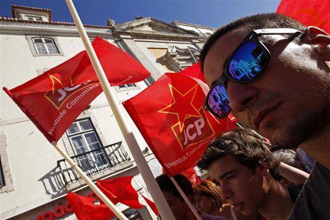 Communist Party members march during a protest calling for a government resignation in Lisbon July 3, 2013. REUTERS/Jose Manuel Ribeiro Communist Party members march during a protest calling for a government resignation in Lisbon July 3, 2013. REUTERS/Jose Manuel Ribeiro