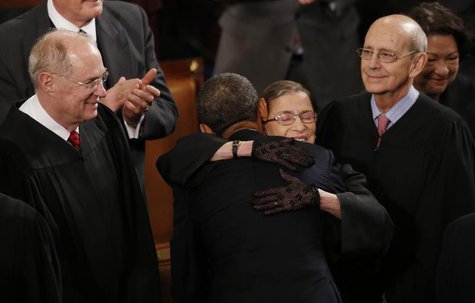 U.S. Supreme Court Justice Ruth Bader Ginsburg hugs President Barack Obama as fellow Supreme Court Justices Anthony Kennedy (L) and Stephen U.S. Supreme Court Justice Ruth Bader Ginsburg hugs President Barack Obama as fellow Supreme Court Justices Anthony Kennedy (L) and Stephen