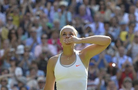 Sabine Lisicki of Germany celebrates after defeating Agnieszka Radwanska of Poland in their women's semi-final tennis match at the Wimbledon Sabine Lisicki of Germany celebrates after defeating Agnieszka Radwanska of Poland in their women's semi-final tennis match at the Wimbledon