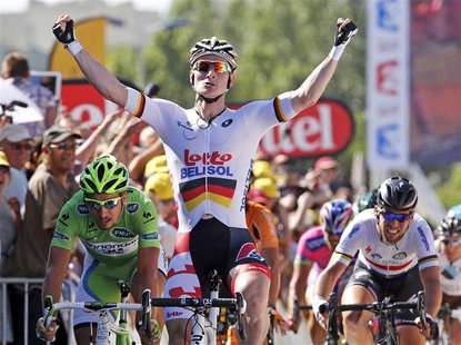 Lotto-Belisol team rider Andre Greipel (C) of Germany celebrates as he wins the 176.5 km fifth stage of the centenary Tour de France cycling Lotto-Belisol team rider Andre Greipel (C) of Germany celebrates as he wins the 176.5 km fifth stage of the centenary Tour de France cycling