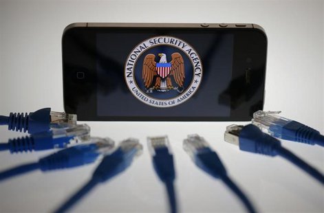 An illustration picture shows the logo of the U.S. National Security Agency on the display of an iPhone in Berlin, June 7, 2013. REUTERS/Paw An illustration picture shows the logo of the U.S. National Security Agency on the display of an iPhone in Berlin, June 7, 2013. REUTERS/Paw