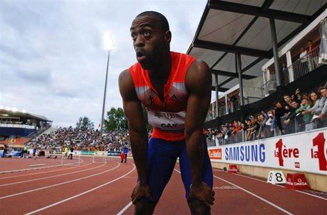 Tyson Gay of the U.S. reacts after winning in the 100m event of the Lausanne Diamond League meeting in Lausanne, July 4, 2013. REUTERS/Denis Tyson Gay of the U.S. reacts after winning in the 100m event of the Lausanne Diamond League meeting in Lausanne, July 4, 2013. REUTERS/Denis