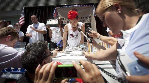 Competitive eater Takeru Kobayashi is interviewed after competing in a hot dog eating competition in New York, July 4, 2013. Kobayashi ate 6 Competitive eater Takeru Kobayashi is interviewed after competing in a hot dog eating competition in New York, July 4, 2013. Kobayashi ate 6