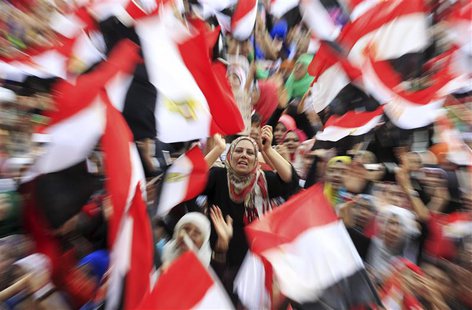 Protesters against ousted President Mohamed Mursi wave Egyptian flags in Tahrir Square in Cairo July 4, 2013. The leader of the Muslim Broth Protesters against ousted President Mohamed Mursi wave Egyptian flags in Tahrir Square in Cairo July 4, 2013. The leader of the Muslim Broth