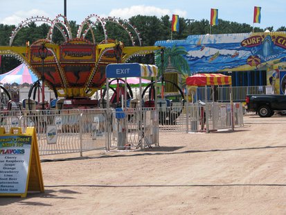 Midway rides being set up. Midway rides being set up.