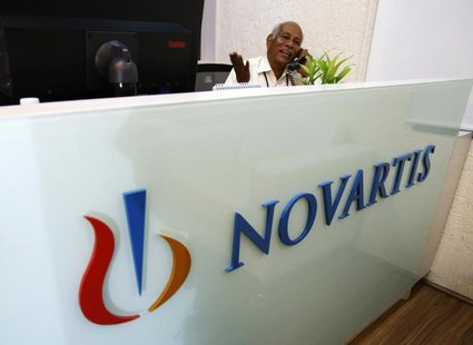 A man speaks on a telephone inside Novartis India headquarters in Mumbai April 1, 2013. REUTERS/Vivek Prakash A man speaks on a telephone inside Novartis India headquarters in Mumbai April 1, 2013. REUTERS/Vivek Prakash