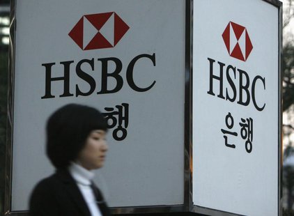 A woman walks past a HSBC logo at a branch office in Seoul March 5, 2008. REUTERS/Jo Yong-Hak A woman walks past a HSBC logo at a branch office in Seoul March 5, 2008. REUTERS/Jo Yong-Hak