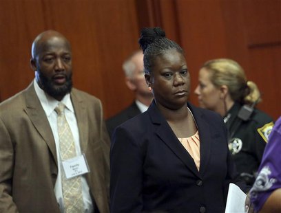 Trayvon Martin's parents Tracy Martin (L), and Sybrina Fulton enter the courtroom after a morning recess in George Zimmerman secondnd-degree Trayvon Martin's parents Tracy Martin (L), and Sybrina Fulton enter the courtroom after a morning recess in George Zimmerman secondnd-degree
