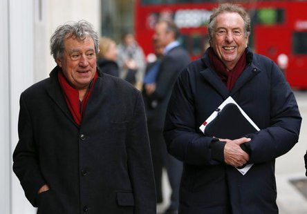 Monty Python members Eric Idle (R) and Terry Jones return to the High Court after a lunch break in central London December 4, 2012. REUTERS/ Monty Python members Eric Idle (R) and Terry Jones return to the High Court after a lunch break in central London December 4, 2012. REUTERS/