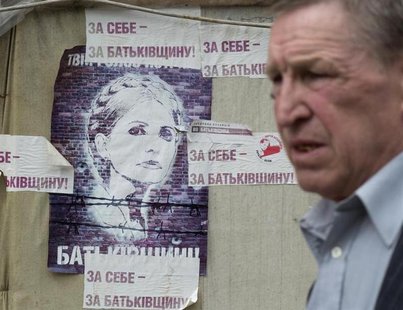 A man walks past a protest tent camp of supporters of jailed Ukrainian ex-prime minister Yulia Tymoshenko in central Kiev April 30, 2013. RE A man walks past a protest tent camp of supporters of jailed Ukrainian ex-prime minister Yulia Tymoshenko in central Kiev April 30, 2013. RE