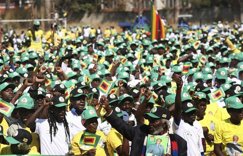 Supporters cheer Zimbabwean President Robert Mugabe as he arrives to launch his ruling ZANU PF party's election manifesto in the capital Har Supporters cheer Zimbabwean President Robert Mugabe as he arrives to launch his ruling ZANU PF party's election manifesto in the capital Har