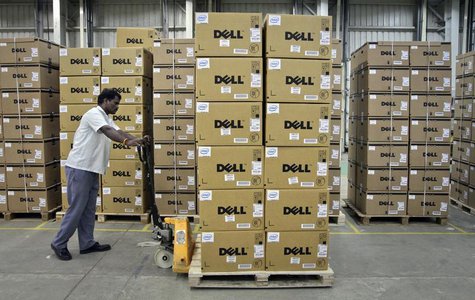 A man pushes a trolley full of Dell computers through a company factory in Sriperumbudur Taluk, in the Kancheepuram district of the southern A man pushes a trolley full of Dell computers through a company factory in Sriperumbudur Taluk, in the Kancheepuram district of the southern