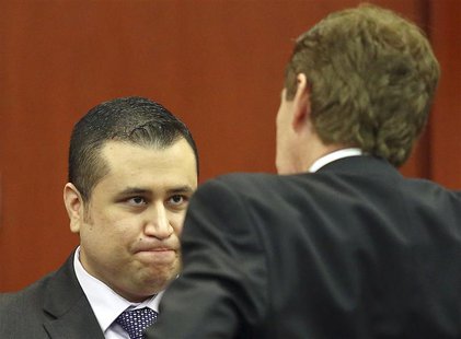 George Zimmerman chats with his defense attorney Mark O'Mara (R) during an early morning recess in his secondnd-degree murder trial in the f George Zimmerman chats with his defense attorney Mark O'Mara (R) during an early morning recess in his secondnd-degree murder trial in the f