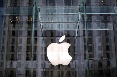 The Apple logo hangs inside the glass entrance to the Apple Store on 5th Avenue in New York City, April 4, 2013. REUTERS/Mike Segar The Apple logo hangs inside the glass entrance to the Apple Store on 5th Avenue in New York City, April 4, 2013. REUTERS/Mike Segar