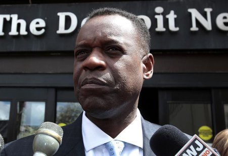 Detroit's Emergency Financial Manager Kevyn Orr talks to members of the media outside the Detroit Newspapers building about the report he de Detroit's Emergency Financial Manager Kevyn Orr talks to members of the media outside the Detroit Newspapers building about the report he de