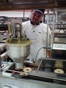 Nicholas Roberts turns raw doughnut batter into fresh hot doughnuts. (KELO/KELQ) Nicholas Roberts turns raw doughnut batter into fresh hot doughnuts. (KELO/KELQ)