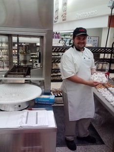 Nicholas Roberts displays fresh hot powdered doughnut bites fresh off the machine. (Photo: KELO/KELQ) Nicholas Roberts displays fresh hot powdered doughnut bites fresh off the machine. (Photo: KELO/KELQ)